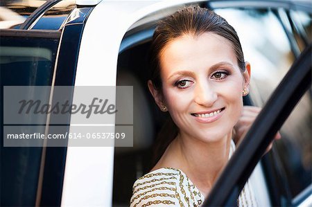 Woman climbing out of car