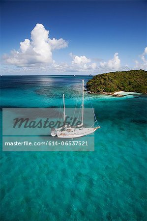 Sailboat in tropical water