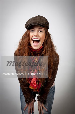 Laughing woman leaning on knees