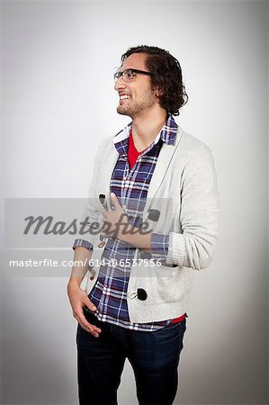 Smiling man holding his stomach