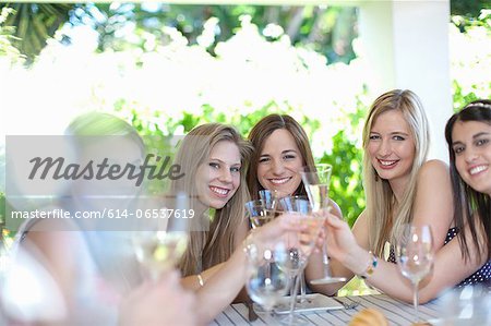 Women toasting each other with champagne Women toasting each other with champagne