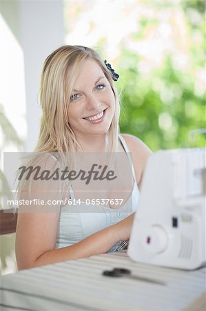 Woman working on sewing machine
