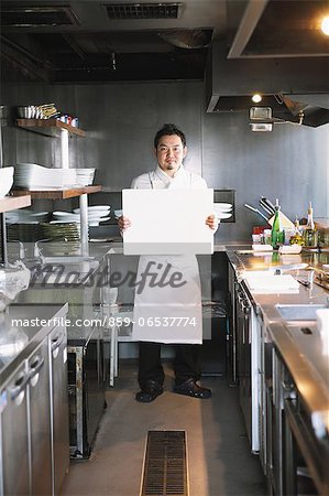 Chef holding a whiteboard