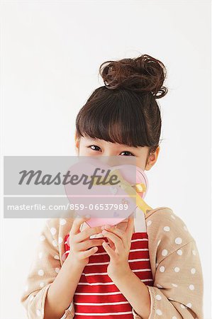 Young girl with apron holding a chocolate box