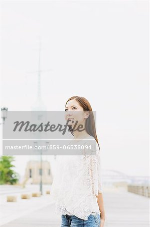 Young woman looking up