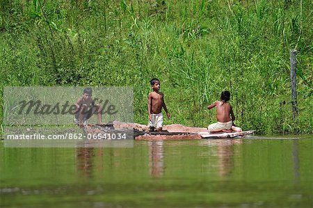Indian boys playing in the river, Amacayon Indian Village, Amazon river, Puerto Narino, Colombia