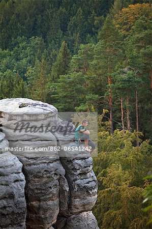 Czech Republic, Bohemia, Prahovskie Region, A mountain climber on one of the hills at the Prahovskie Skali nature reseve. Unesco tentative list