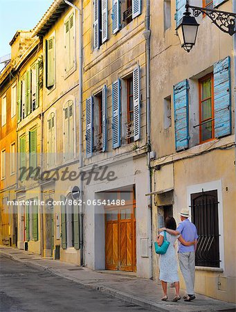 France, Provence, Arles, man and woman walking through oldtown MR France, Provence, Arles, man and woman walking through oldtown MR