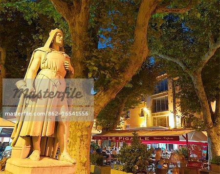 France, Provence, Orange, Place de la Republic, Rimbaud 11 statue at dusk