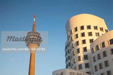 Dusseldorf, North Rhine Westphalia, Germany, Detail of the Neuer Zollhof building and the Rheinturm Tower