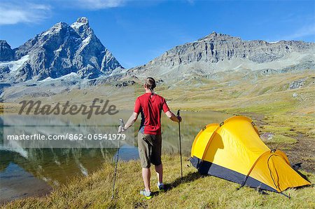 Europe, Italy, Aosta Valley, Monte Cervino , The Matterhorn, Breuil Cervinia, hiker and tent , MR,