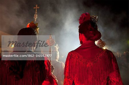 El Rocio, Huelva, Southern Spain. Women in traditional clothes participating in night celebrations on the eve of the feast of El Rocio