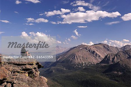 Man sat along Trail Ridge Road in the Rocky Mountain National Park, Colorado, USA