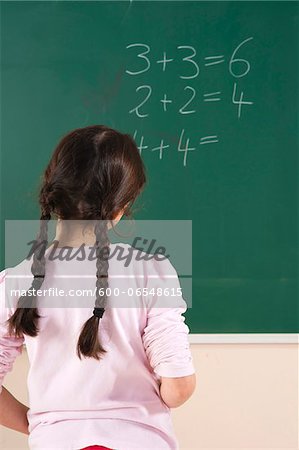 Girl Answering Question at Blackboard in Classroom, Baden-Wurttemberg, Germany