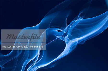 Blue smoke on black background