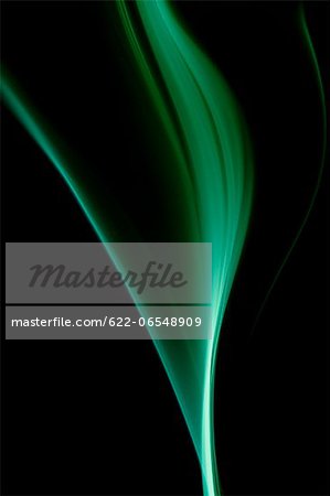 Green smoke on black background Green smoke on black background