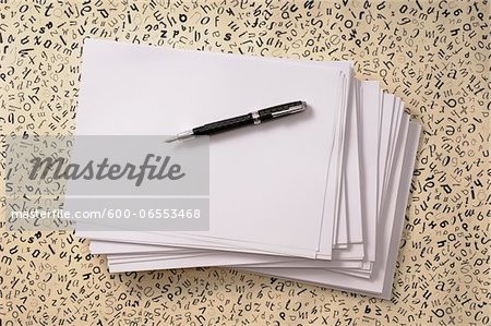 Overhead View of Pen on Stack of Paper