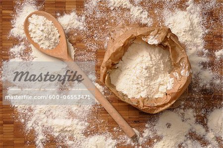 Overhead View of Bag of Flour and Wooden Spoon