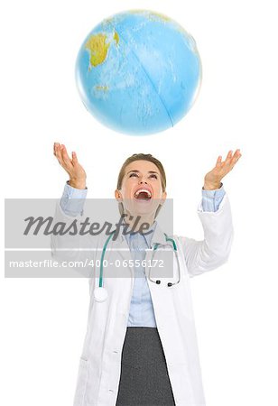 Happy medical doctor woman throws up globe