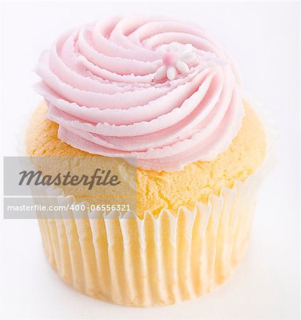 Pink frosted cupcake with flower decoration