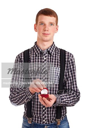 Man holding red box with wedding ring