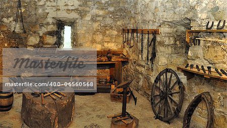 museum exposition of an blacksmith workshop in a castle. panorama photo