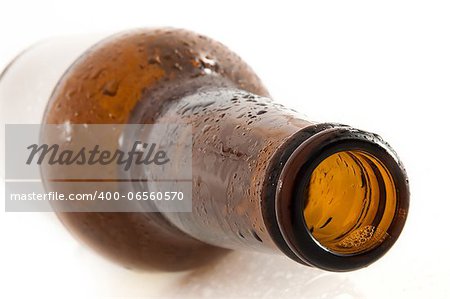 empty brown beer bottle with empty label, white background