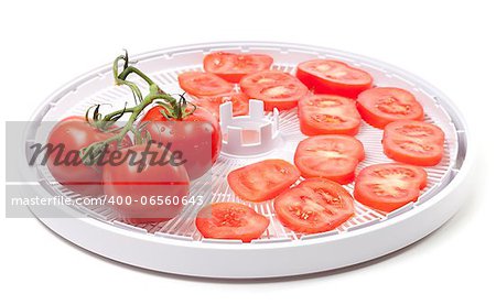 Fresh tomato prepared to dehydrated. On white background.