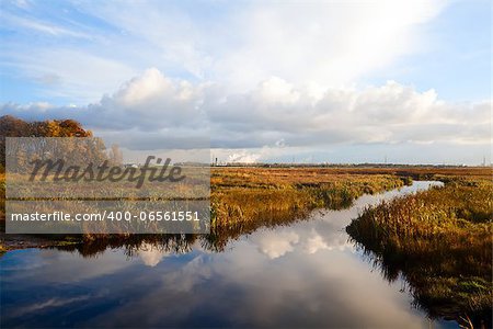 lake with reflections after sunrise in Drenthe, Netherlands