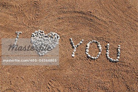 I love You picture from pebble and sand on a beach