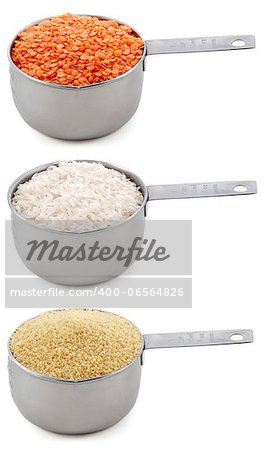 Staple ingredients - lentils, white rice and cous-cous - in cup measures, isolated on a white background
