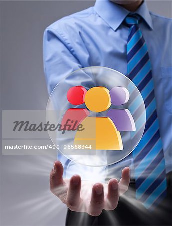 Power of social networking concept with glass sphere over businessman hand