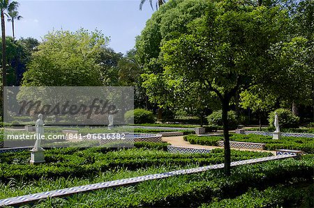 Statues and flower beds, Maria Luisa park, Seville, Andalusia, Spain, Europe