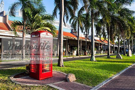 Red telephone box in downtown Oranjestad, capital of Aruba, ABC Islands, Netherlands Antilles, Caribbean, Central America