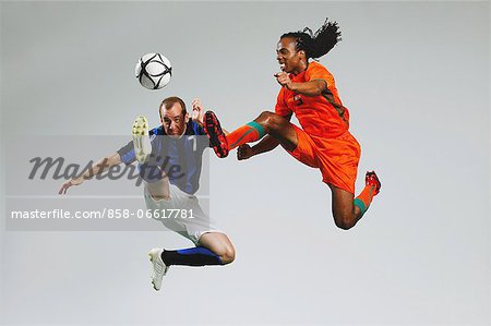 Men In Soccer Uniform With Ball