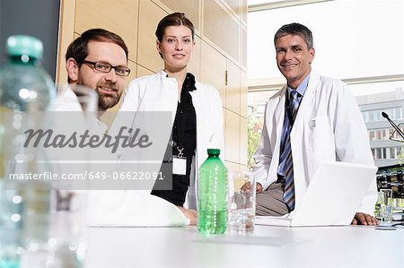 Doctors smiling at desk