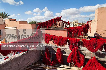 Dyed wool drying on lines