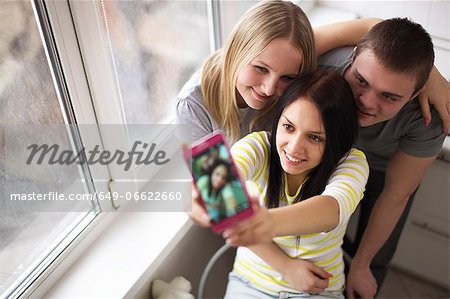 Teenage friends taking picture together