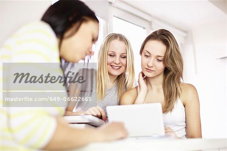 Teenage girls studying together