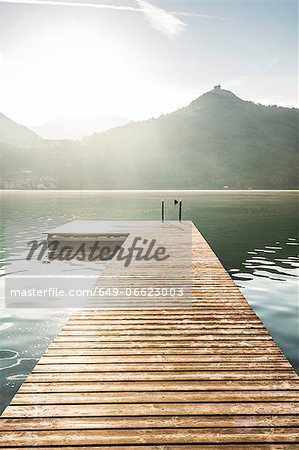 Wooden pier in still rural lake