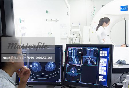 Nurse examining x-rays in hospital