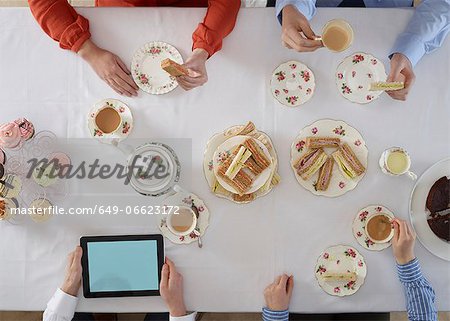 Overhead view of people having tea