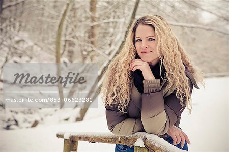 Blond woman wearing winther clothes outdoors