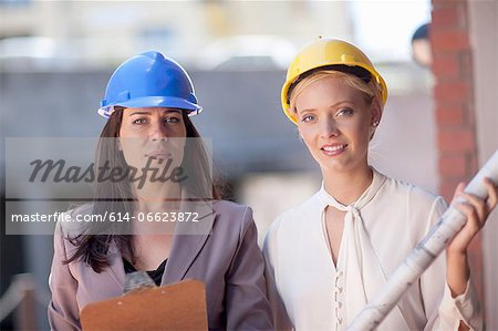 Businesswomen wearing hard hats