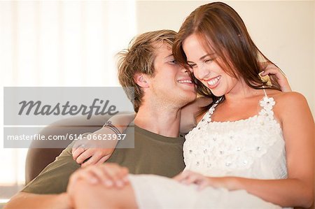 Man holding girlfriend on his lap