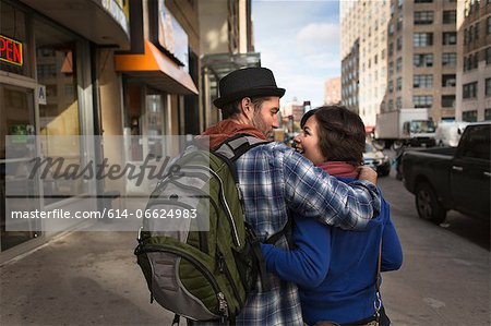 Couple walking on city street