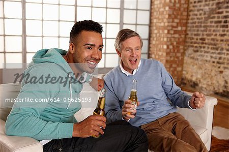 Father and son watching sports together