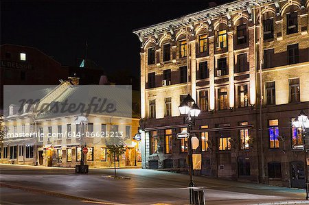 Ornate city buildings lit up at night