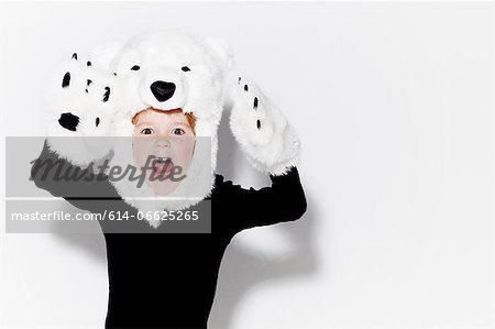 Boy wearing bear head and claws