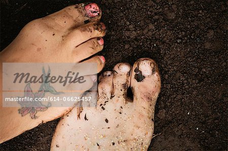 Close up of toes in dirt
